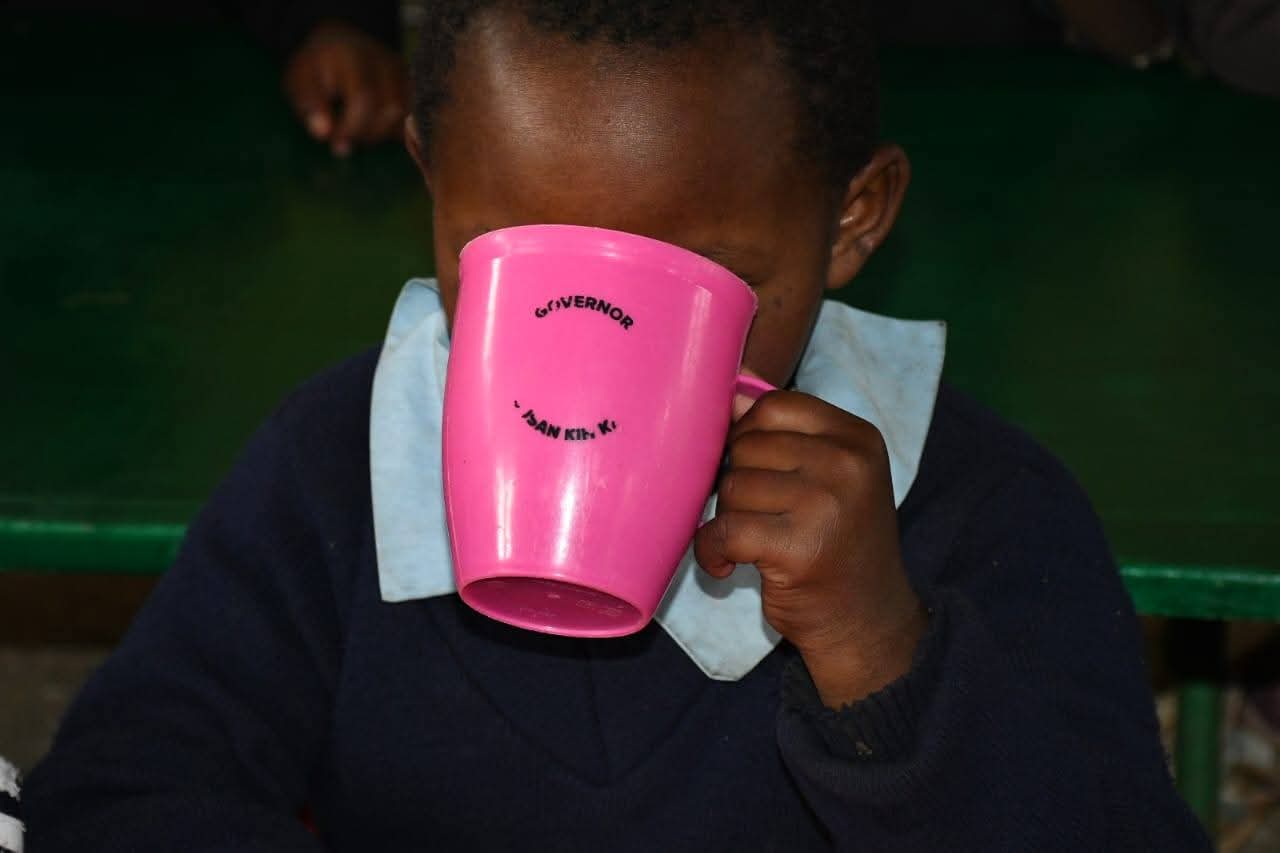A learner takes a break with Lishe na Mama uji